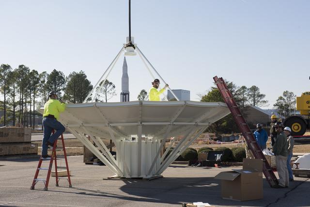 NASA image: SETTING A NEW SATELLITE RECEIVING ANTENNA