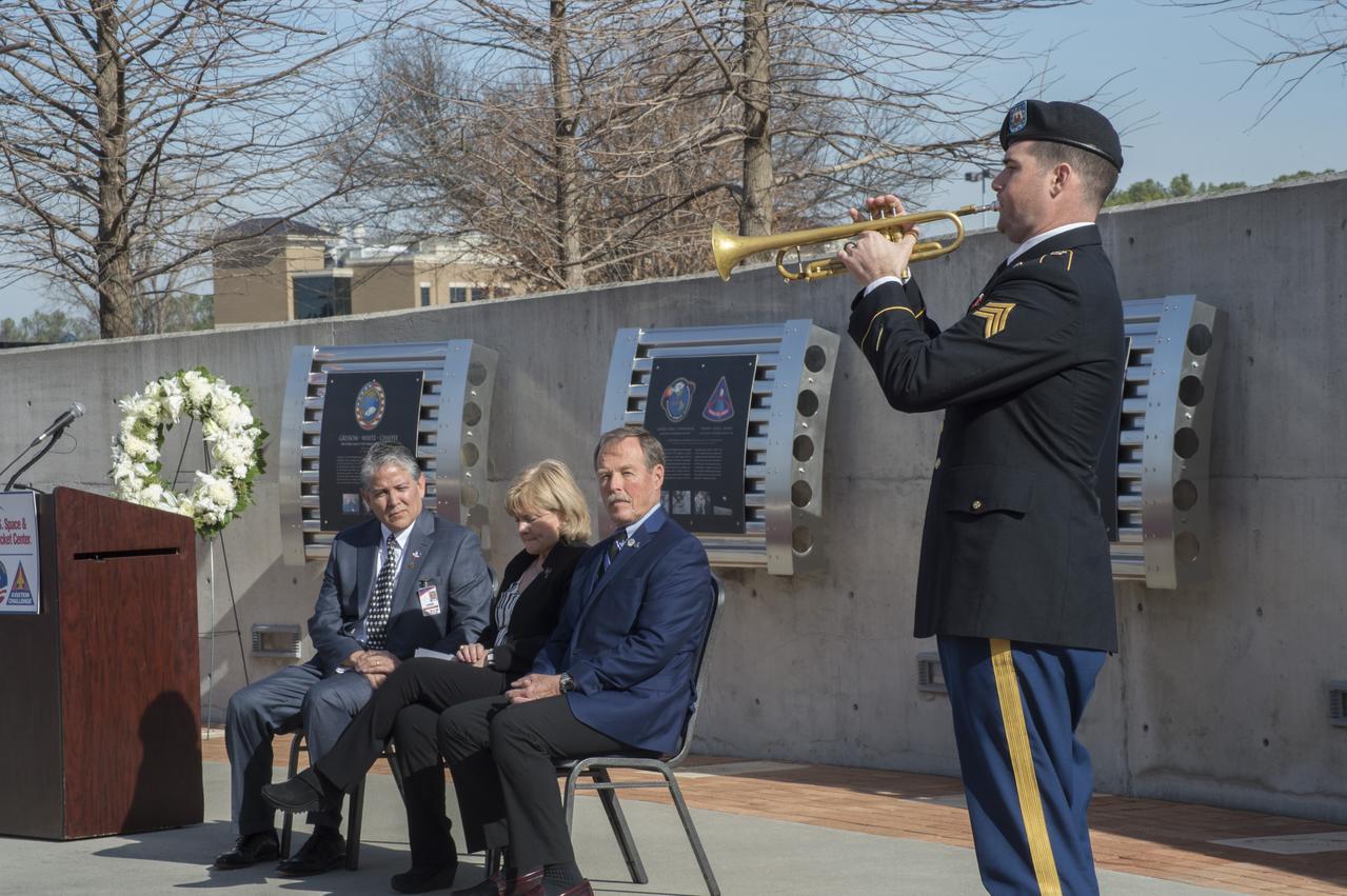 SGT. JAMES OLD, RIGHT, PERFORMS THE INTRODUCTION FROM JAMES HORNER'S "APOLLO 13" FILM SCORE AT THE U.S. SPACE AND ROCKET CENTER'S MEMORIAL EVENT HONORING NASA'S LOST SPACE HEROES.