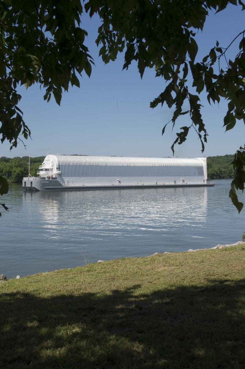 NASA’s barge, Pegasus, approaches the barge dock on Redstone Arsenal, home to the Marshall Space Flight Center. Pegasus is transporting the RS-25 engine core stage test article from the Michoud Assembly Facility to Marshall for structural testing.