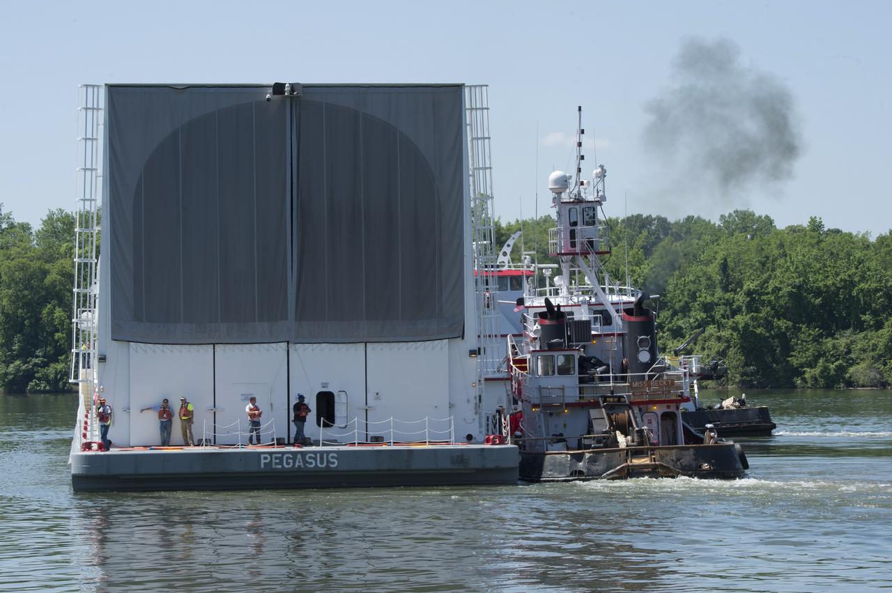 NASA’s barge, Pegasus, approaches the barge dock on Redstone Arsenal, home to the Marshall Space Flight Center. Pegasus is transporting the RS-25 engine core stage test article from the Michoud Assembly Facility to Marshall for structural testing.