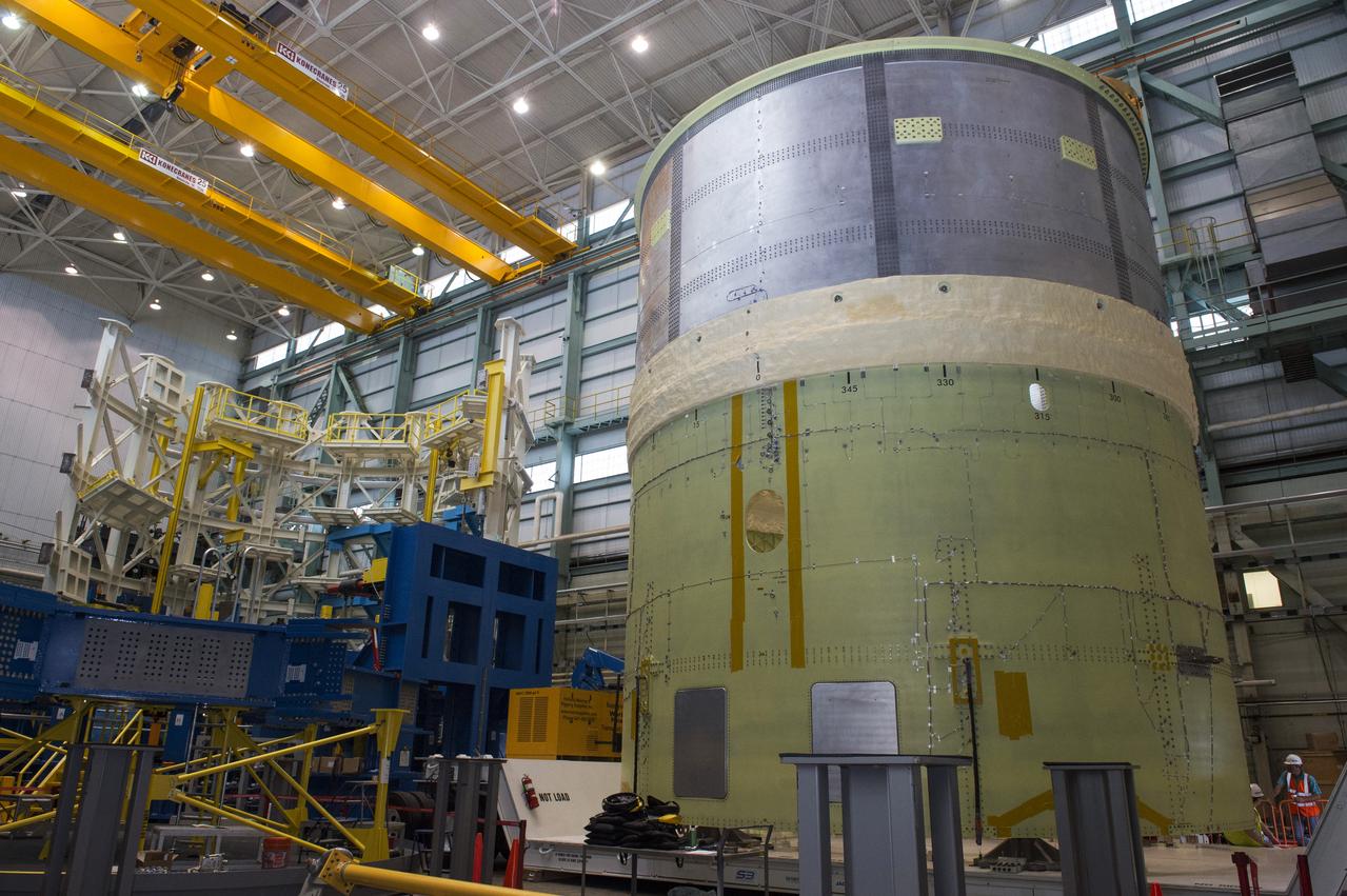 NASA engineers install test hardware for the agency's new heavy lift rocket, the Space Launch System, into a newly constructed 50-foot structural test stand at NASA's Marshall Space Flight Center. In the stand, hydraulic cylinders will be electronically controlled to push, pull, twist and bend the test article with millions of pounds of force. Engineers will record and analyze over 3,000 channels of data for each test case to verify the capabilities of the engine section and validate that the design and analysis models accurately predict the amount of loads the core stage can withstand during launch and ascent. The engine section, recently delivered via NASA's barge Pegasus from NASA's Michoud Assembly Facility, is the first of four core stage structural test articles scheduled to be delivered to Marshall for testing. The engine section, located at the bottom of SLS's massive core stage, will house the rocket's four RS-25 engines and be an attachment point for the two solid rocket boosters.