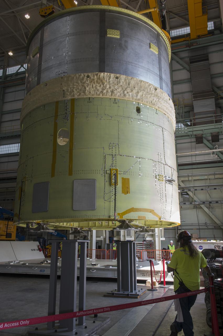 NASA engineers install test hardware for the agency's new heavy lift rocket, the Space Launch System, into a newly constructed 50-foot structural test stand at NASA's Marshall Space Flight Center. In the stand, hydraulic cylinders will be electronically controlled to push, pull, twist and bend the test article with millions of pounds of force. Engineers will record and analyze over 3,000 channels of data for each test case to verify the capabilities of the engine section and validate that the design and analysis models accurately predict the amount of loads the core stage can withstand during launch and ascent. The engine section, recently delivered via NASA's barge Pegasus from NASA's Michoud Assembly Facility, is the first of four core stage structural test articles scheduled to be delivered to Marshall for testing. The engine section, located at the bottom of SLS's massive core stage, will house the rocket's four RS-25 engines and be an attachment point for the two solid rocket boosters.