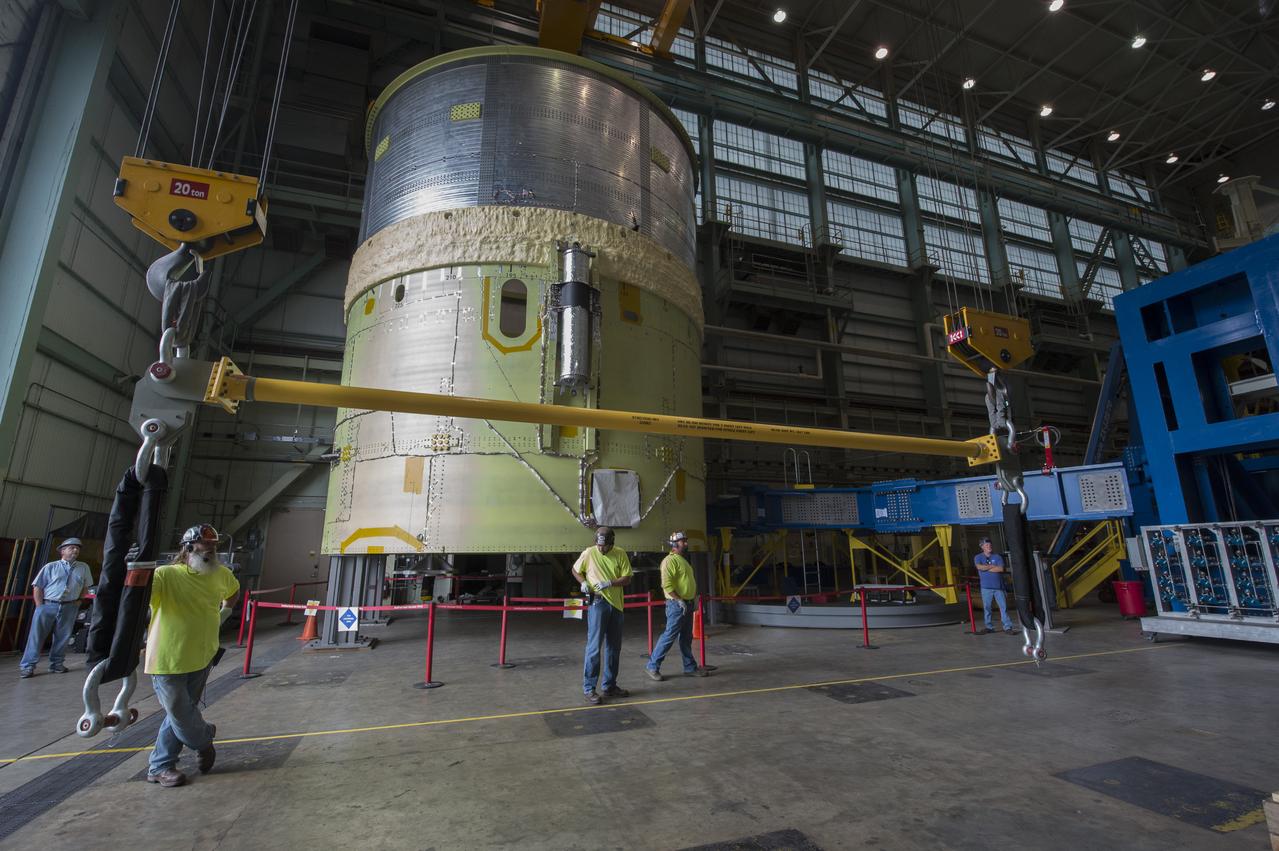 NASA engineers install test hardware for the agency's new heavy lift rocket, the Space Launch System, into a newly constructed 50-foot structural test stand at NASA's Marshall Space Flight Center. In the stand, hydraulic cylinders will be electronically controlled to push, pull, twist and bend the test article with millions of pounds of force. Engineers will record and analyze over 3,000 channels of data for each test case to verify the capabilities of the engine section and validate that the design and analysis models accurately predict the amount of loads the core stage can withstand during launch and ascent. The engine section, recently delivered via NASA's barge Pegasus from NASA's Michoud Assembly Facility, is the first of four core stage structural test articles scheduled to be delivered to Marshall for testing. The engine section, located at the bottom of SLS's massive core stage, will house the rocket's four RS-25 engines and be an attachment point for the two solid rocket boosters.