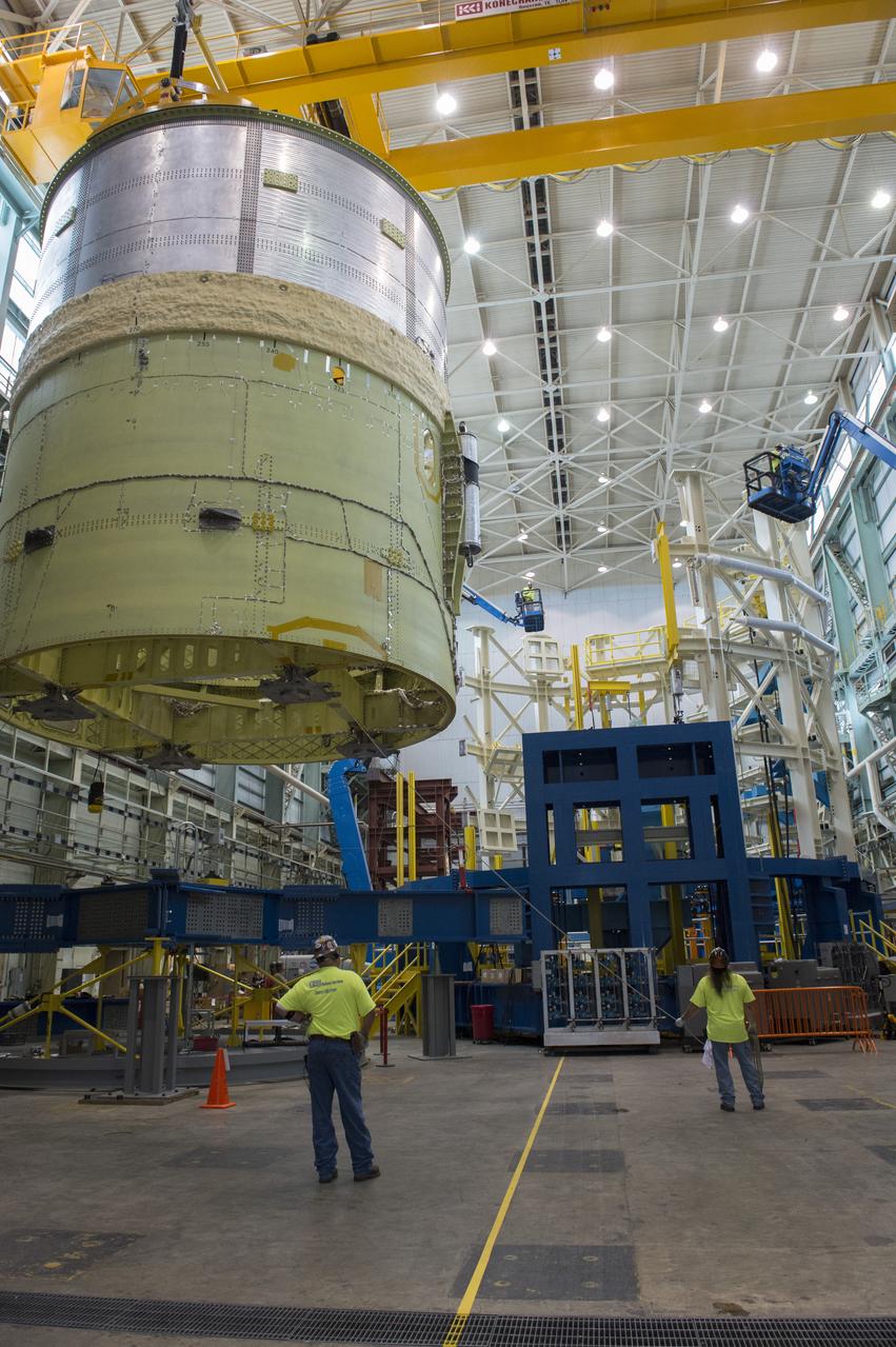 NASA engineers install test hardware for the agency's new heavy lift rocket, the Space Launch System, into a newly constructed 50-foot structural test stand at NASA's Marshall Space Flight Center. In the stand, hydraulic cylinders will be electronically controlled to push, pull, twist and bend the test article with millions of pounds of force. Engineers will record and analyze over 3,000 channels of data for each test case to verify the capabilities of the engine section and validate that the design and analysis models accurately predict the amount of loads the core stage can withstand during launch and ascent. The engine section, recently delivered via NASA's barge Pegasus from NASA's Michoud Assembly Facility, is the first of four core stage structural test articles scheduled to be delivered to Marshall for testing. The engine section, located at the bottom of SLS's massive core stage, will house the rocket's four RS-25 engines and be an attachment point for the two solid rocket boosters.