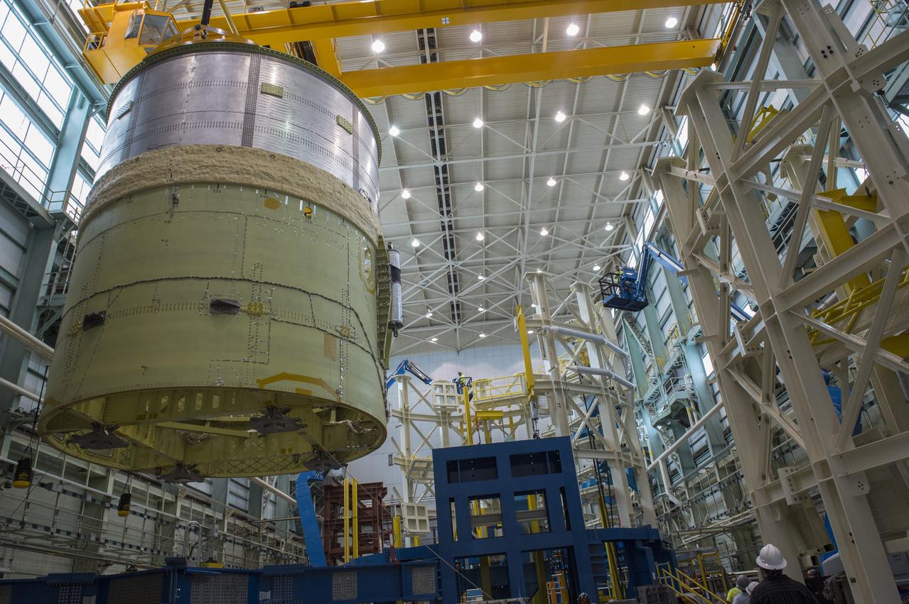NASA engineers install test hardware for the agency's new heavy lift rocket, the Space Launch System, into a newly constructed 50-foot structural test stand at NASA's Marshall Space Flight Center. In the stand, hydraulic cylinders will be electronically controlled to push, pull, twist and bend the test article with millions of pounds of force. Engineers will record and analyze over 3,000 channels of data for each test case to verify the capabilities of the engine section and validate that the design and analysis models accurately predict the amount of loads the core stage can withstand during launch and ascent. The engine section, recently delivered via NASA's barge Pegasus from NASA's Michoud Assembly Facility, is the first of four core stage structural test articles scheduled to be delivered to Marshall for testing. The engine section, located at the bottom of SLS's massive core stage, will house the rocket's four RS-25 engines and be an attachment point for the two solid rocket boosters.