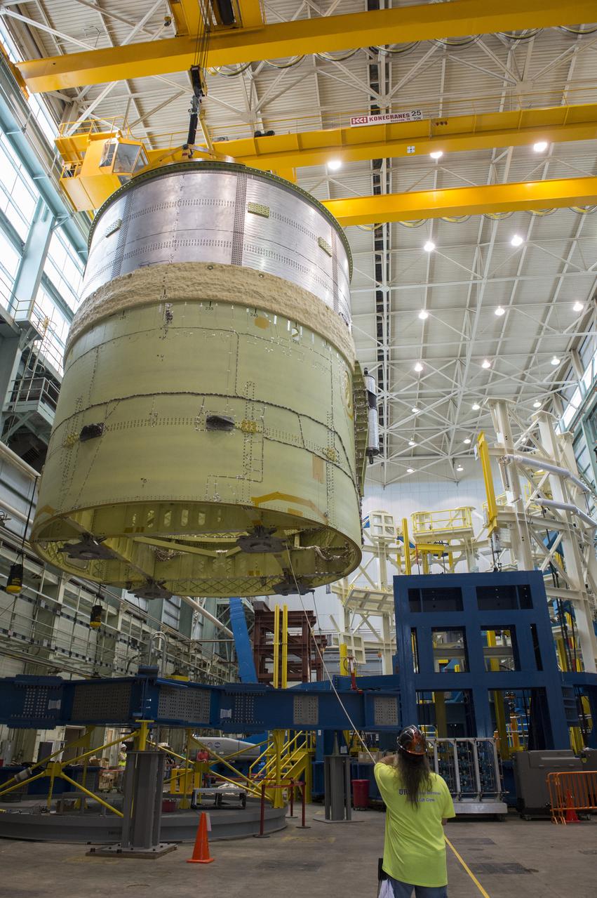 NASA engineers install test hardware for the agency's new heavy lift rocket, the Space Launch System, into a newly constructed 50-foot structural test stand at NASA's Marshall Space Flight Center. In the stand, hydraulic cylinders will be electronically controlled to push, pull, twist and bend the test article with millions of pounds of force. Engineers will record and analyze over 3,000 channels of data for each test case to verify the capabilities of the engine section and validate that the design and analysis models accurately predict the amount of loads the core stage can withstand during launch and ascent. The engine section, recently delivered via NASA's barge Pegasus from NASA's Michoud Assembly Facility, is the first of four core stage structural test articles scheduled to be delivered to Marshall for testing. The engine section, located at the bottom of SLS's massive core stage, will house the rocket's four RS-25 engines and be an attachment point for the two solid rocket boosters.