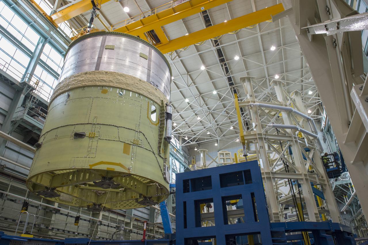 NASA engineers install test hardware for the agency's new heavy lift rocket, the Space Launch System, into a newly constructed 50-foot structural test stand at NASA's Marshall Space Flight Center. In the stand, hydraulic cylinders will be electronically controlled to push, pull, twist and bend the test article with millions of pounds of force. Engineers will record and analyze over 3,000 channels of data for each test case to verify the capabilities of the engine section and validate that the design and analysis models accurately predict the amount of loads the core stage can withstand during launch and ascent. The engine section, recently delivered via NASA's barge Pegasus from NASA's Michoud Assembly Facility, is the first of four core stage structural test articles scheduled to be delivered to Marshall for testing. The engine section, located at the bottom of SLS's massive core stage, will house the rocket's four RS-25 engines and be an attachment point for the two solid rocket boosters.