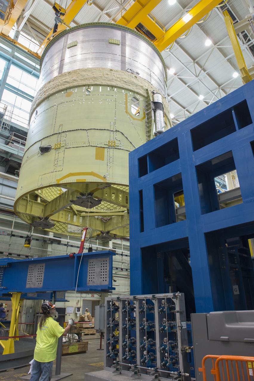 NASA engineers install test hardware for the agency's new heavy lift rocket, the Space Launch System, into a newly constructed 50-foot structural test stand at NASA's Marshall Space Flight Center. In the stand, hydraulic cylinders will be electronically controlled to push, pull, twist and bend the test article with millions of pounds of force. Engineers will record and analyze over 3,000 channels of data for each test case to verify the capabilities of the engine section and validate that the design and analysis models accurately predict the amount of loads the core stage can withstand during launch and ascent. The engine section, recently delivered via NASA's barge Pegasus from NASA's Michoud Assembly Facility, is the first of four core stage structural test articles scheduled to be delivered to Marshall for testing. The engine section, located at the bottom of SLS's massive core stage, will house the rocket's four RS-25 engines and be an attachment point for the two solid rocket boosters.