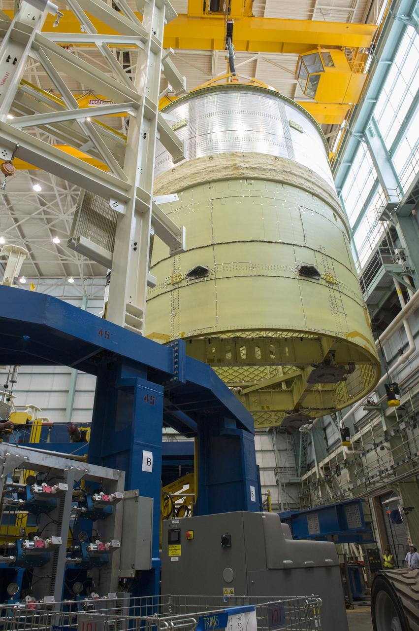 NASA engineers install test hardware for the agency's new heavy lift rocket, the Space Launch System, into a newly constructed 50-foot structural test stand at NASA's Marshall Space Flight Center. In the stand, hydraulic cylinders will be electronically controlled to push, pull, twist and bend the test article with millions of pounds of force. Engineers will record and analyze over 3,000 channels of data for each test case to verify the capabilities of the engine section and validate that the design and analysis models accurately predict the amount of loads the core stage can withstand during launch and ascent. The engine section, recently delivered via NASA's barge Pegasus from NASA's Michoud Assembly Facility, is the first of four core stage structural test articles scheduled to be delivered to Marshall for testing. The engine section, located at the bottom of SLS's massive core stage, will house the rocket's four RS-25 engines and be an attachment point for the two solid rocket boosters.