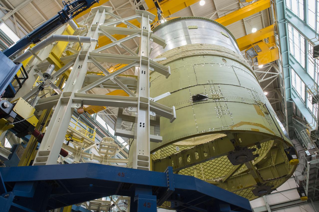NASA engineers install test hardware for the agency's new heavy lift rocket, the Space Launch System, into a newly constructed 50-foot structural test stand at NASA's Marshall Space Flight Center. In the stand, hydraulic cylinders will be electronically controlled to push, pull, twist and bend the test article with millions of pounds of force. Engineers will record and analyze over 3,000 channels of data for each test case to verify the capabilities of the engine section and validate that the design and analysis models accurately predict the amount of loads the core stage can withstand during launch and ascent. The engine section, recently delivered via NASA's barge Pegasus from NASA's Michoud Assembly Facility, is the first of four core stage structural test articles scheduled to be delivered to Marshall for testing. The engine section, located at the bottom of SLS's massive core stage, will house the rocket's four RS-25 engines and be an attachment point for the two solid rocket boosters.