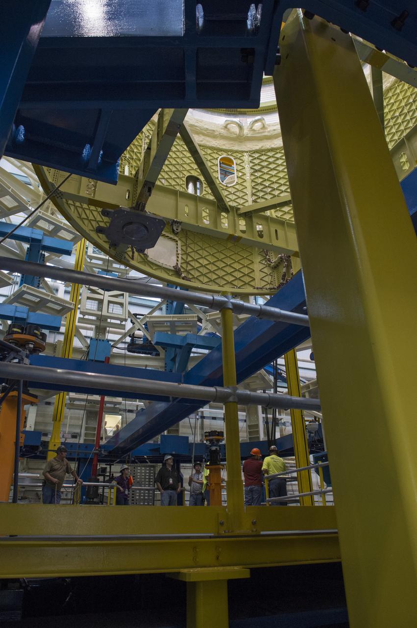 NASA engineers install test hardware for the agency's new heavy lift rocket, the Space Launch System, into a newly constructed 50-foot structural test stand at NASA's Marshall Space Flight Center. In the stand, hydraulic cylinders will be electronically controlled to push, pull, twist and bend the test article with millions of pounds of force. Engineers will record and analyze over 3,000 channels of data for each test case to verify the capabilities of the engine section and validate that the design and analysis models accurately predict the amount of loads the core stage can withstand during launch and ascent. The engine section, recently delivered via NASA's barge Pegasus from NASA's Michoud Assembly Facility, is the first of four core stage structural test articles scheduled to be delivered to Marshall for testing. The engine section, located at the bottom of SLS's massive core stage, will house the rocket's four RS-25 engines and be an attachment point for the two solid rocket boosters.