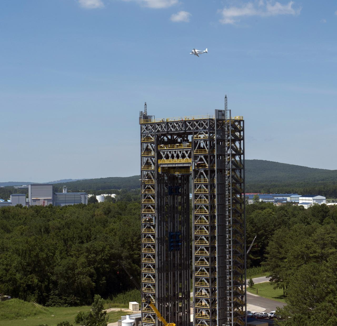 NASA's Super Guppie flies over Marshall Space Flight Center's test stand 4693 in the west test area.