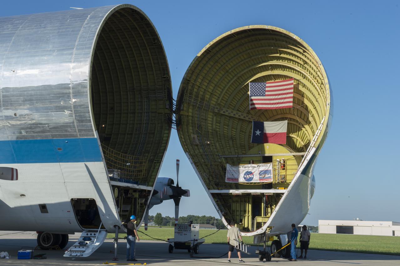 NASA's Super Guppie arrives at Redstone Arsenal airfield to transport the Orion stage adapter to Denver Colorado for further testing. The nose is open exposing the cargo bay.