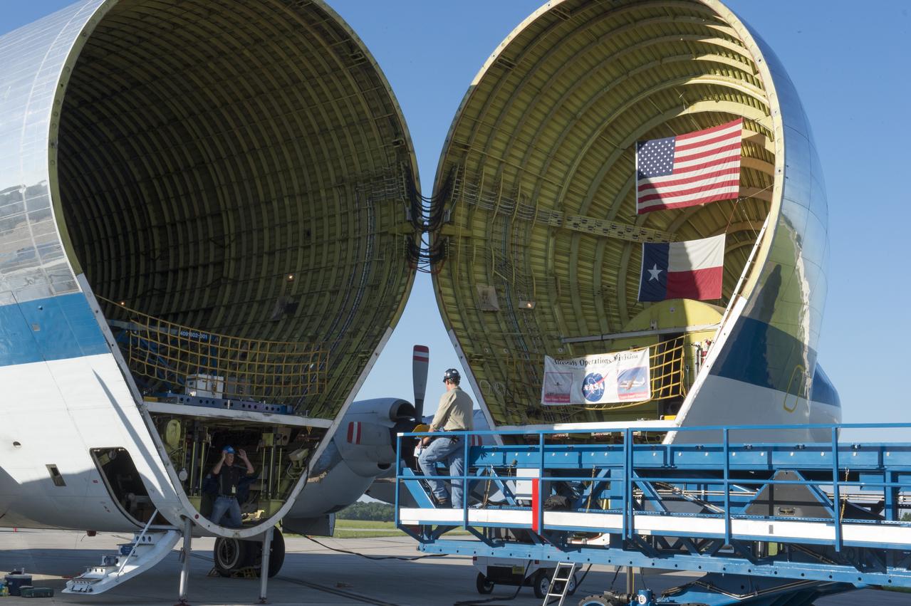 The platform which will be used to load the Orion stage adapter is shown being positioned in front of NASA's Super Guppie. After being tested at Marshall Space Flight Center the stage adapter will be flown to Denver, Colorado for further testing.