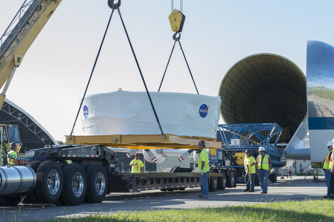 The Orion stage adapter is being lifted for placement onto the loading platform for NASA's Super Guppie aircraft before being flown to Denver, Colorado for further testing.