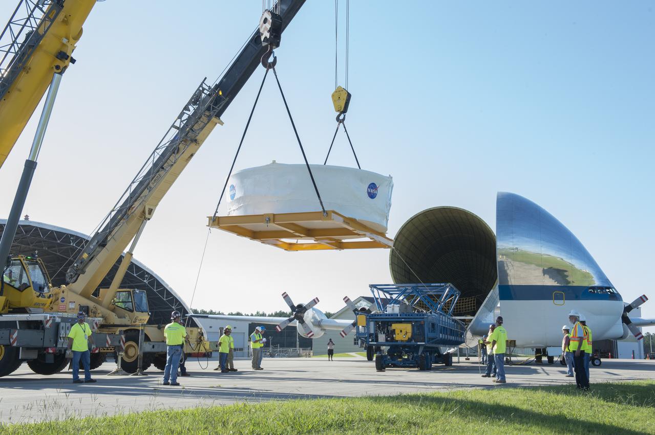 The Orion stage adapter is being lifted for placement onto the loading platform for NASA's Super Guppie aircraft before being flown to Denver, Colorado for further testing.
