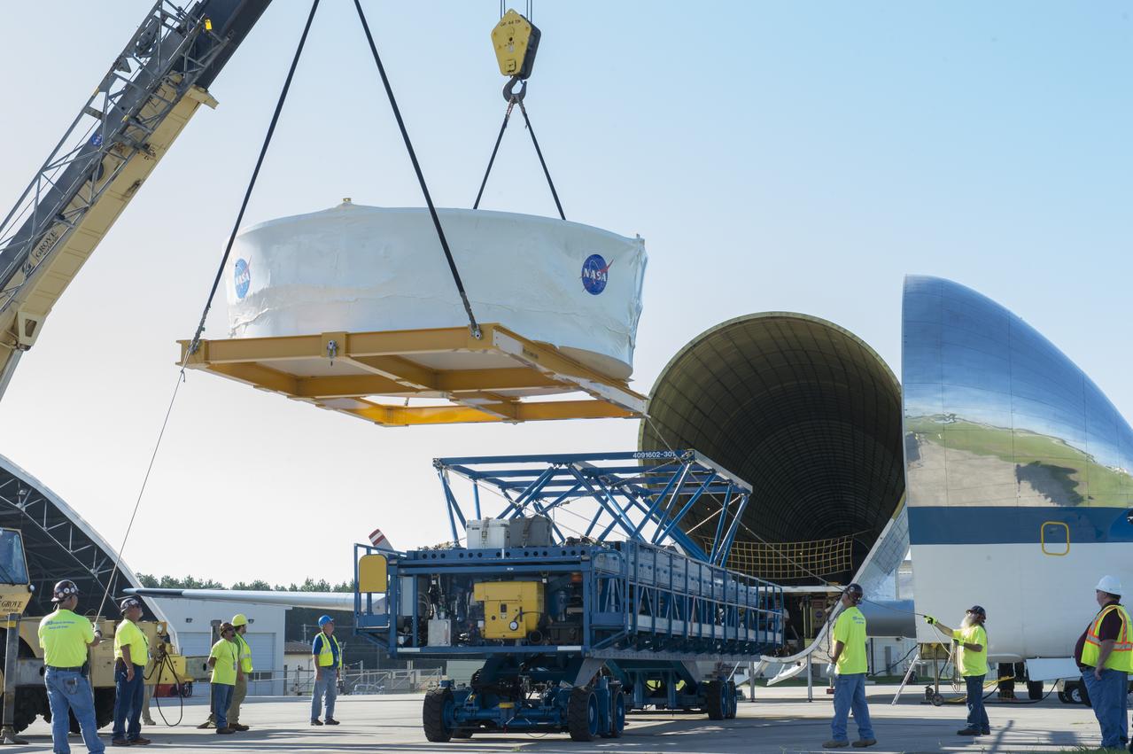 The Orion stage adapter is being lifted for placement onto the loading platform for NASA's Super Guppie aircraft before being flown to Denver, Colorado for further testing.