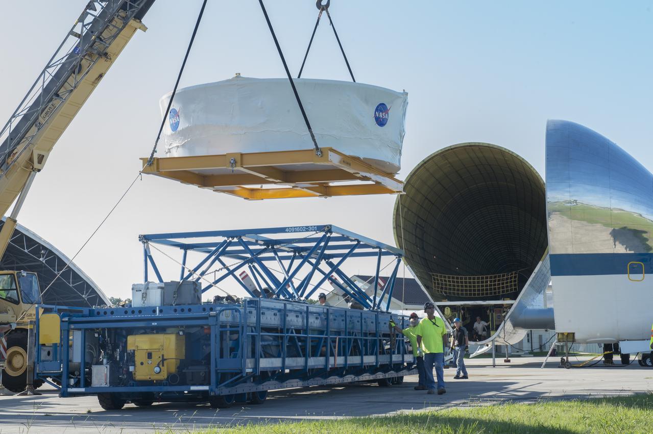 The Orion stage adapter is being lifted for placement onto the loading platform for NASA's Super Guppie aircraft before being flown to Denver, Colorado for further testing.