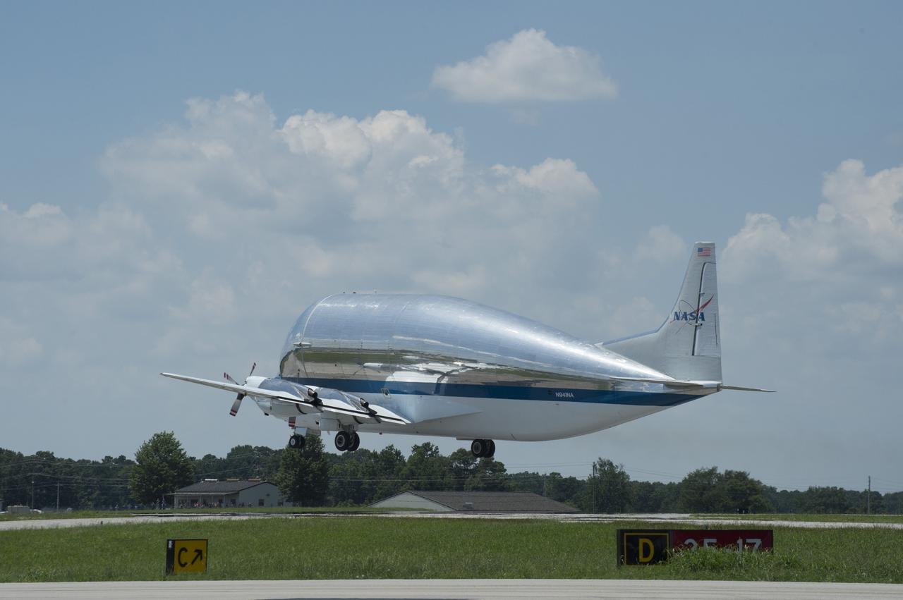 NASA's Super Guppie aircraft lifts off from Redstone Arsenal's airfield with the Orion stage adapter which will be transported to Denver, Colorado for further testing.