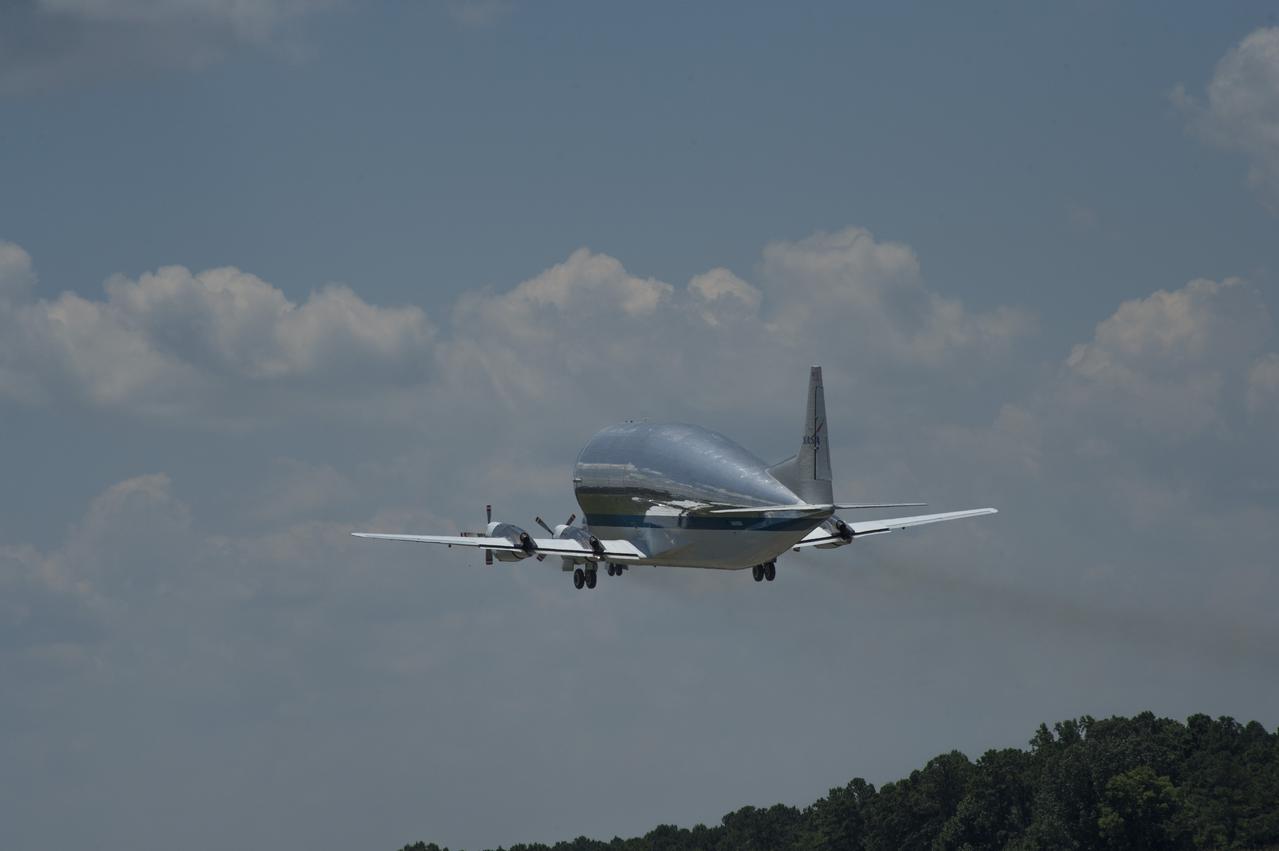 NASA's Super Guppie aircraft lifts off from Redstone Arsenal's airfield with the Orion stage adapter which will be transported to Denver, Colorado for further testing.