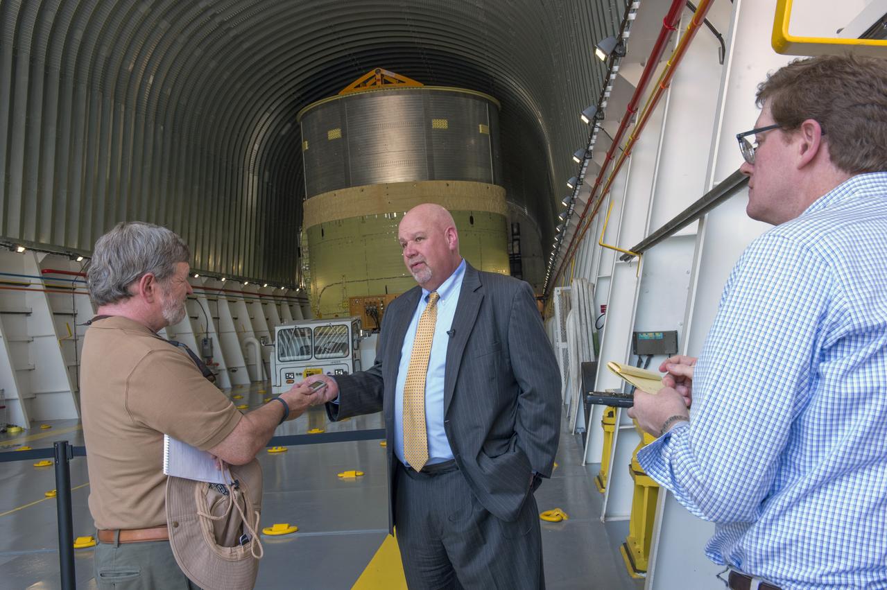 John Honeycutt talks with reporters on NASA Barge Pegasus