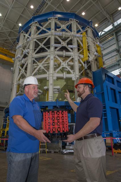 NASA image: John Honeycutt and Mark White with SLS test stand and model