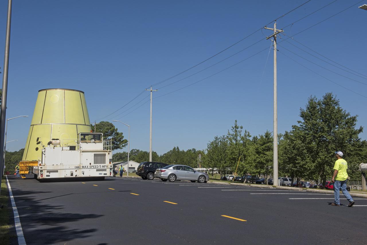 The SLS stage adapter being moved to it's new location from the MSFC Friction Stir Welding lab. This flight article will be sprayed with foam prior to shipment to its next location