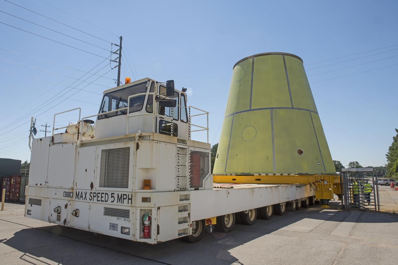 The SLS stage adapter being moved to it's new location from the MSFC Friction Stir Welding lab. This flight article will be sprayed with foam prior to shipment to its next location