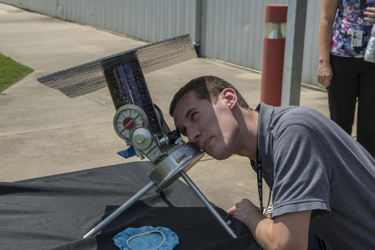 Brad Addona views the beginning of the August 21, 2017 at a viewing  event for Marshall Space Flight Center’s activities building for Marshall employees. The Huntsville area experienced 97 percent occultation, nearly a complete blocking out of the sun by the orbit of Earth's moon. The next opportunity to view a solar eclipse in the eastern and central United States will occur in April 2024.