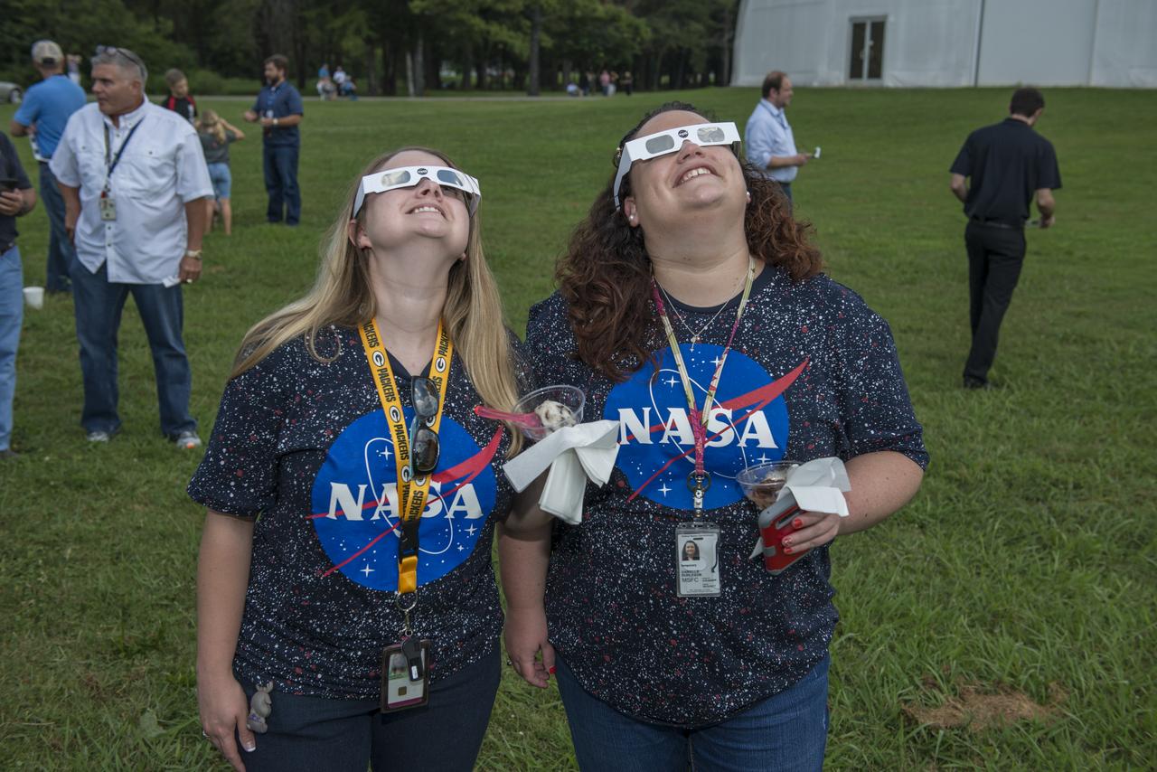 Krisdon Manecke and Danielle Burleson of the Office of the Chief Information Officer (OCIO) view the August 21, 2017 solar eclipse at the Marshall Space Flight Center’s viewing opportunity at the activities building. The Huntsville area experienced 97 percent occultation, nearly a complete blocking out of the sun by the orbit of Earth's moon. The next opportunity to view a solar eclipse in the eastern and central United States will occur in April 2024.