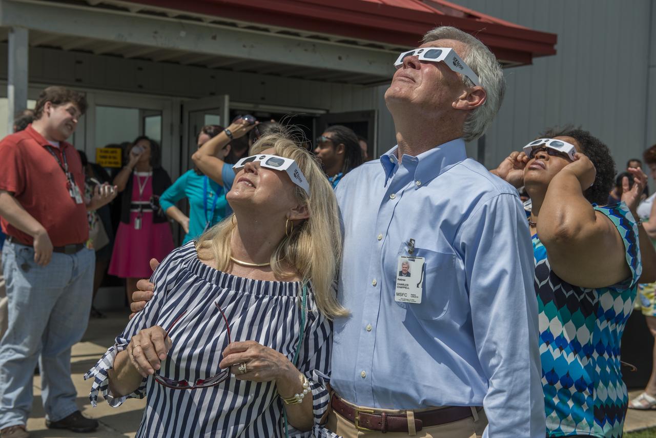Former Spacelab 1 Mission scientist Rick Chappell views the August 21, 2017 solar eclipse with his wife. Chappell, a former associate director for science at Marshall and now a physics professor at Vanderbilt University in Nashville, joined a throng of Marshall personnel to marvel at the eclipse. 