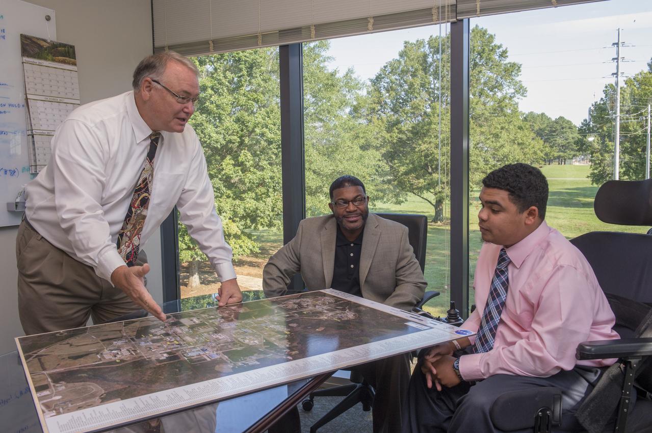 Farley Davis and Edward Ahmad explain map of MSFC to Fall Job Shadowing Student Deshon Washington, a student at Alabama A&M University.