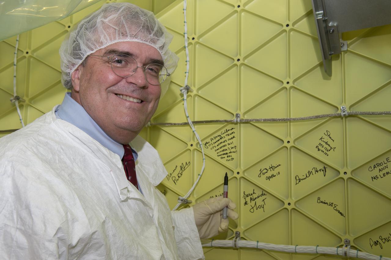 John Culberson, U.S. Congressman, 7th District Texas & Chairman, House Appropriations CJS Committee signs his name on the Orion Stage Adapter while touring MSFC on October 6, 2017.