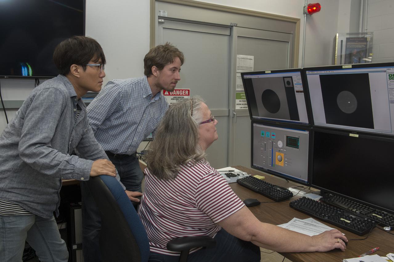 Sangho Jeon (Tufts University), Thomas Leitner (Graz University of Technology), and Trudy Allen analyze data from Dr. Douglas Matson's aerodynamic levitator in support of his MaterialsLab experiments.