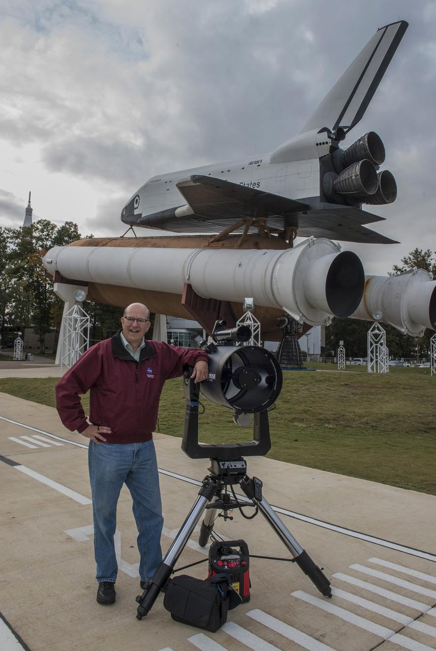 Volunteer Billy Hix with his telescope at International Observe the Moon Night. The event, hosted by the Planetary Missions Program at NASA's Marshall Space Flight Center, encourages observation and appreciation of the Moon and its connection to NASA planetary science and exploration, as well as our cultural and personal connections to it. Children attending the event had the opportunity to participate in planetary, science-based, hands-on activities