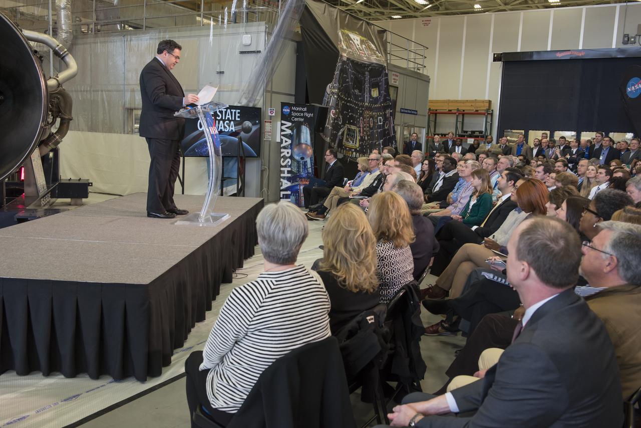 Marshall Space Flight Center Director Todd May introduces NASA Acting Adminstrator Robert Lightfoot prior to his delivery of the "State of NASA", February 12, 2018, at the Marshall Space Flight Center in Huntsville, Alabama. In his address, Lightfoot discussed what the President's Fiscal Year 2019 budget request means for America's space agency. According to Lightfoot, it "reflects the administration's confidence that America will lead the way back to the Moon and take the next giant leap". Lightfoot delivered the "State of NASA" address in Marshall's Center for Advanced Manufacturing where engineers are pushing boundaries in the fields of additive manufacturing, 3D printing, and more. Hardware for NASA's Space Launch System and a model of the agency's Orion spacecraft served as a backdrop for the annual event. SLS, which is managed by Marshall, will enable a new era of exploration beyond Earth's orbit by launching astronauts on missions to deep-space destinations including the Moon and Mars.