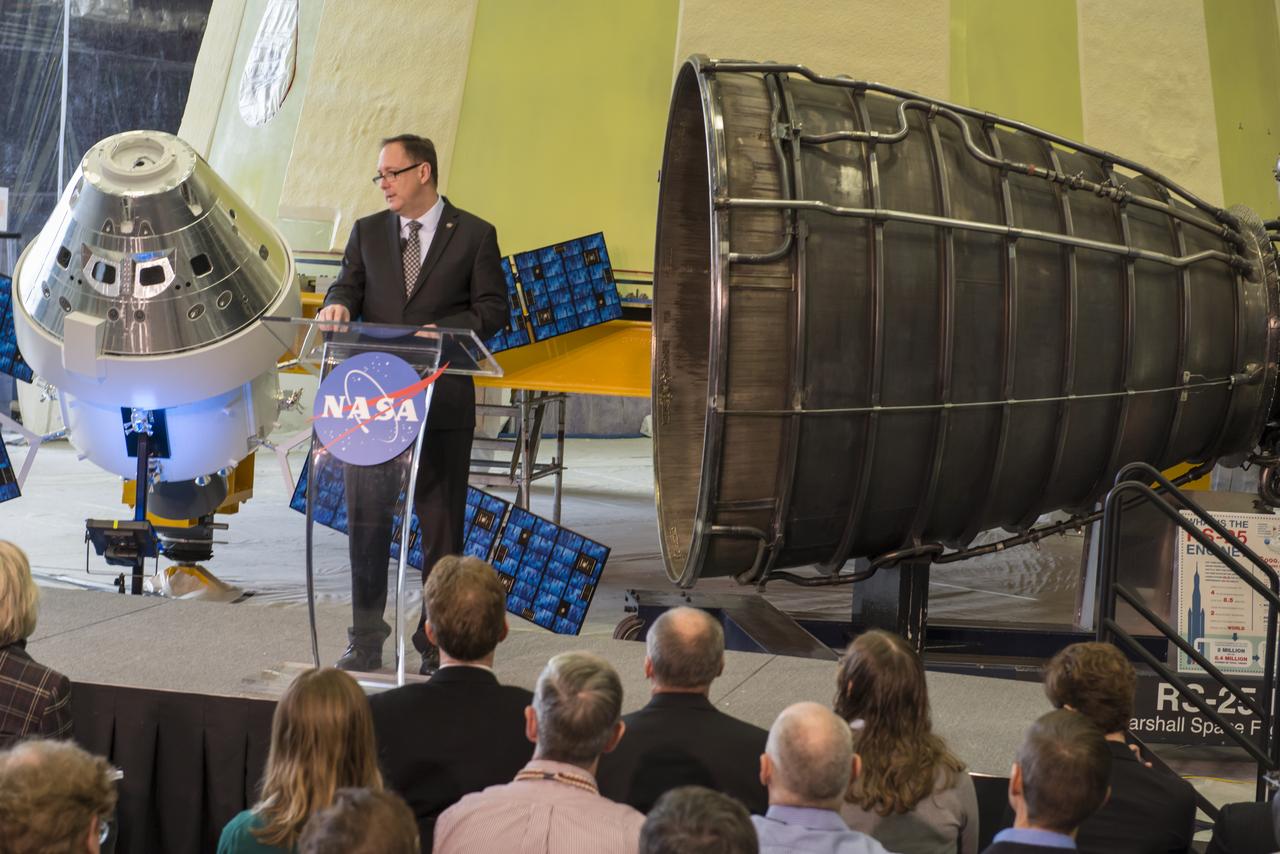 NASA Acting Administrator Robert Lightfoot delivers the "State of NASA", February 12, 2018, at the Marshall Space Flight Center in Huntsville, Alabama. In his address, Lightfoot discussed what the President's Fiscal Year 2019 budget request means for America's space agency. According to Lightfoot, it "reflects the administration's confidence that America will lead the way back to the Moon and take the next giant leap". Lightfoot delivered the "State of NASA" address in Marshall's Center for Advanced Manufacturing where engineers are pushing boundaries in the fields of additive manufacturing, 3D printing, and more. Hardware for NASA's Space Launch System and a model of the agency's Orion spacecraft served as a backdrop for the annual event. SLS, which is managed by Marshall, will enable a new era of exploration beyond Earth's orbit by launching astronauts on missions to deep-space destinations including the Moon and Mars.