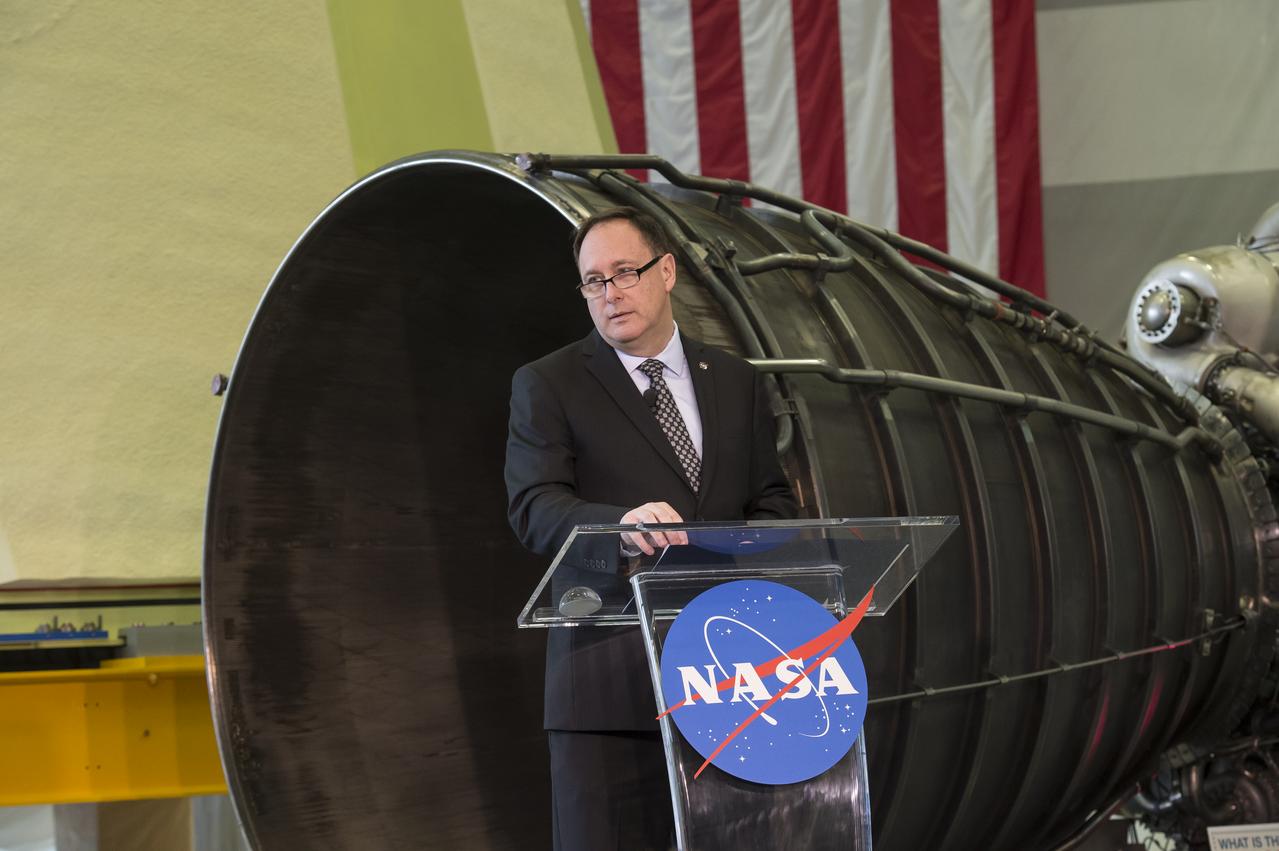 NASA Acting Administrator Robert Lightfoot delivers the "State of NASA", February 12, 2018, at the Marshall Space Flight Center in Huntsville, Alabama. In his address, Lightfoot discussed what the President's Fiscal Year 2019 budget request means for America's space agency. According to Lightfoot, it "reflects the administration's confidence that America will lead the way back to the Moon and take the next giant leap". Lightfoot delivered the "State of NASA" address in Marshall's Center for Advanced Manufacturing where engineers are pushing boundaries in the fields of additive manufacturing, 3D printing, and more. Hardware for NASA's Space Launch System and a model of the agency's Orion spacecraft served as a backdrop for the annual event. SLS, which is managed by Marshall, will enable a new era of exploration beyond Earth's orbit by launching astronauts on missions to deep-space destinations including the Moon and Mars.
