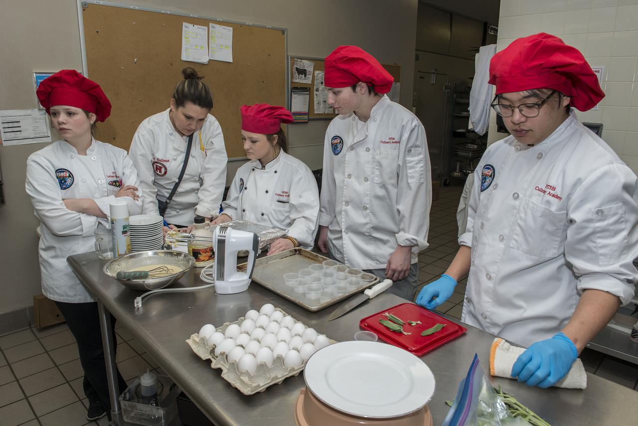 High Schools United with NASA to Create Hardware (HUNCH) students from 6 schools meet at the U.S. Space and Rocket center in order to participate in the annual culinary challenge where students create meals suitable for astronaut use in space. Students in 2018 created different dishes for breakfast dining. Other NASA centers also participate in this program with the top 10 voted recipes being judged at Johnson Space Center.