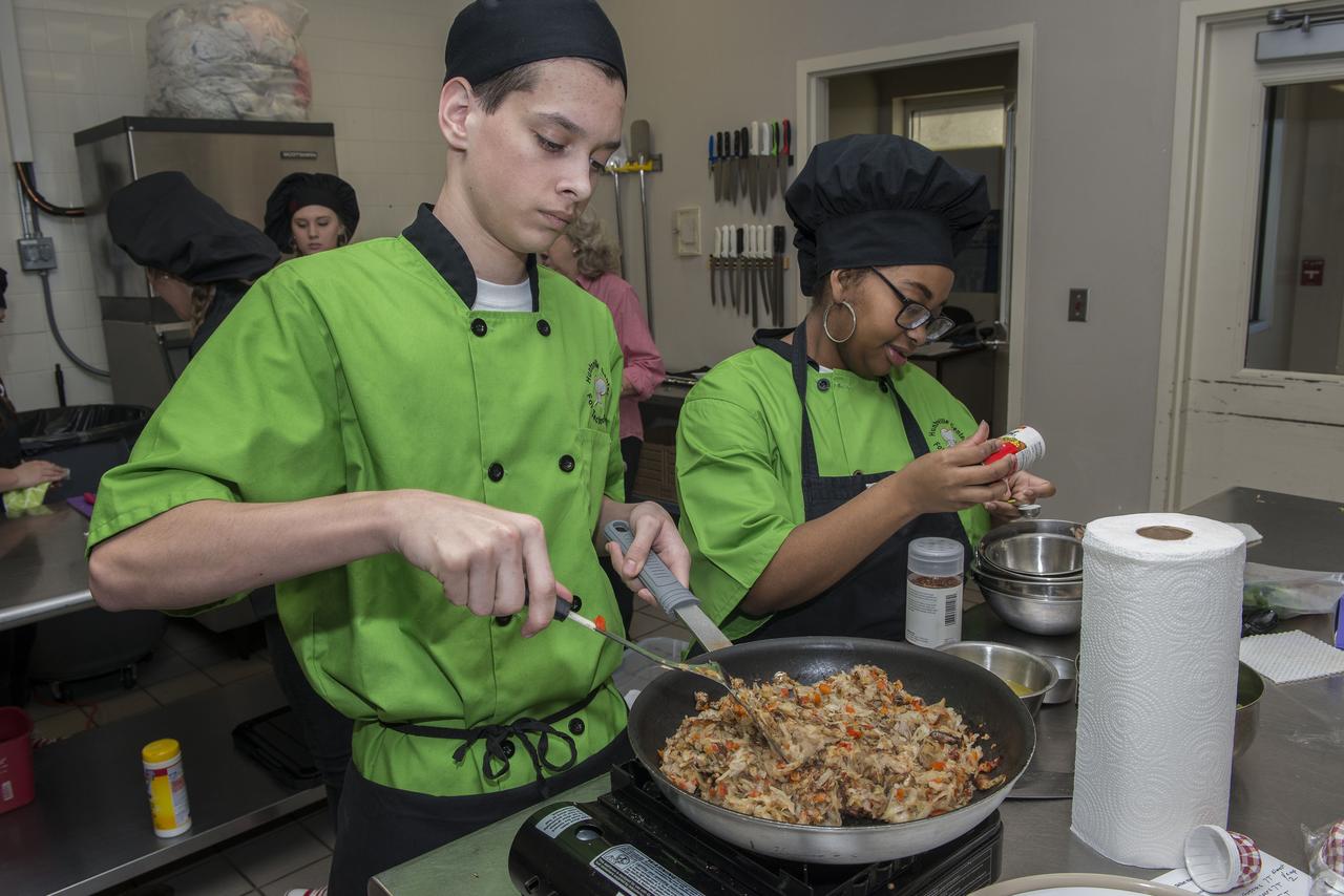 High Schools United with NASA to Create Hardware (HUNCH) students from 6 schools meet at the U.S. Space and Rocket center in order to participate in the annual culinary challenge where students create meals suitable for astronaut use in space. Students in 2018 created different dishes for breakfast dining. Other NASA centers also participate in this program with the top 10 voted recipes being judged at Johnson Space Center.