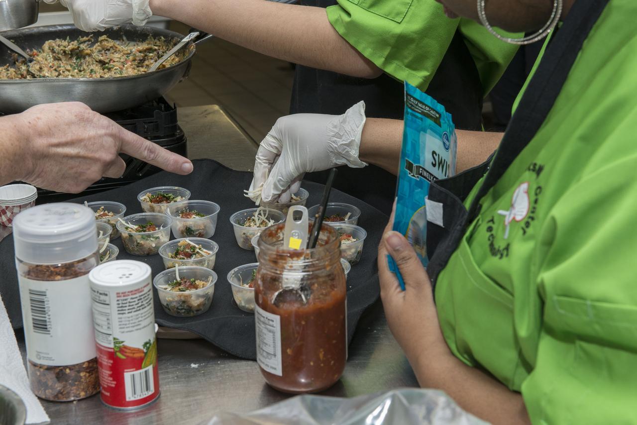 High Schools United with NASA to Create Hardware (HUNCH) students from 6 schools meet at the U.S. Space and Rocket center in order to participate in the annual culinary challenge where students create meals suitable for astronaut use in space. Students in 2018 created different dishes for breakfast dining. Other NASA centers also participate in this program with the top 10 voted recipes being judged at Johnson Space Center.