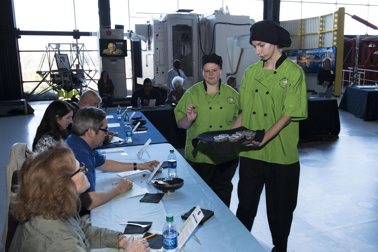 High Schools United with NASA to Create Hardware (HUNCH) students from 6 schools meet at the U.S. Space and Rocket center in order to participate in the annual culinary challenge where students create meals suitable for astronaut use in space. Students in 2018 created different dishes for breakfast dining. Other NASA centers also participate in this program with the top 10 voted recipes being judged at Johnson Space Center.