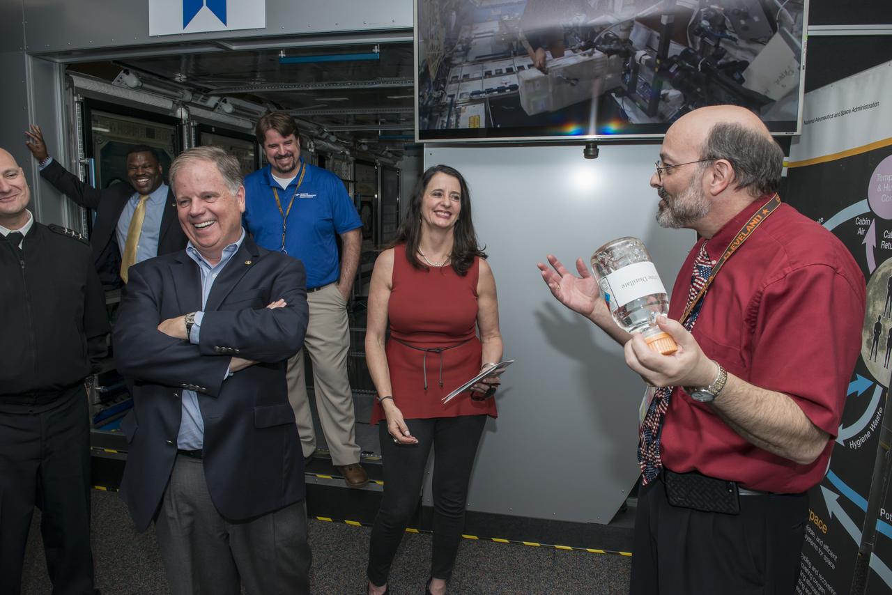 Senator Doug Jones (D-Al.) and wife Louise are presented an overview of the Environmental Control and Life Support System (ECLSS) which was developed at Marshall Space flight Center. Marshall engineer Keith Parrish explains the steps in converting waste fluids generated on the International Space Station (ISS) into purified drinking water.