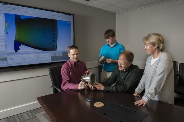 NASA image: Engineers with nozzles fabricated using a freeform-directed ener