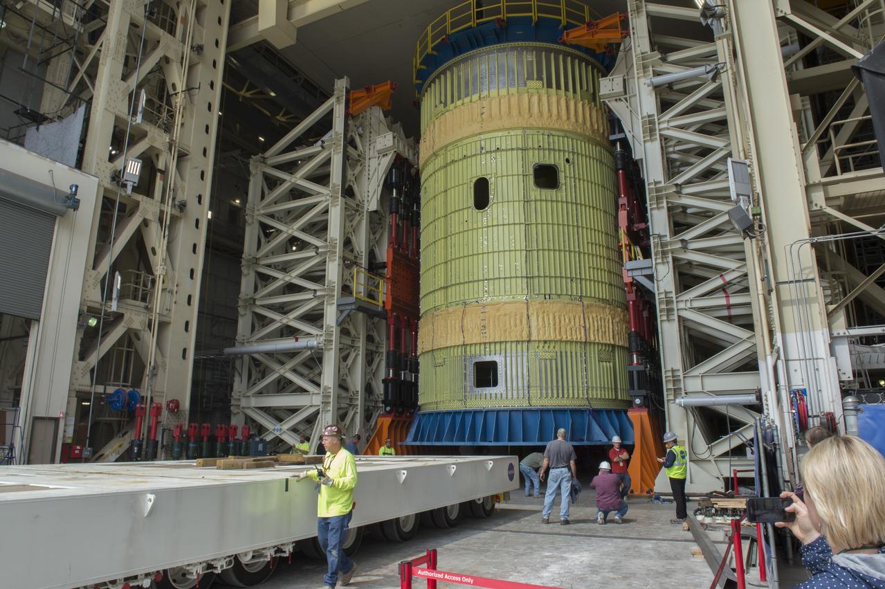 SLS Intertank Test Article, ITA, is attached to crosshead of load test Annex, Bldg. 4619, and removed from bed of KMAG transporter.  ITA is slowly raised from bed of KMAG transporter and KMAG is removed.
