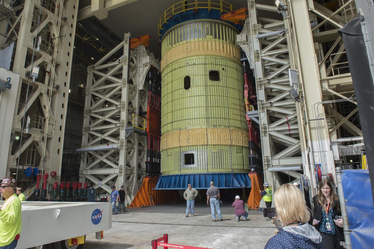 SLS Intertank Test Article, ITA, is attached to crosshead of load test Annex, Bldg. 4619, and removed from bed of KMAG transporter.  ITA is slowly raised from bed of KMAG transporter and KMAG is removed.