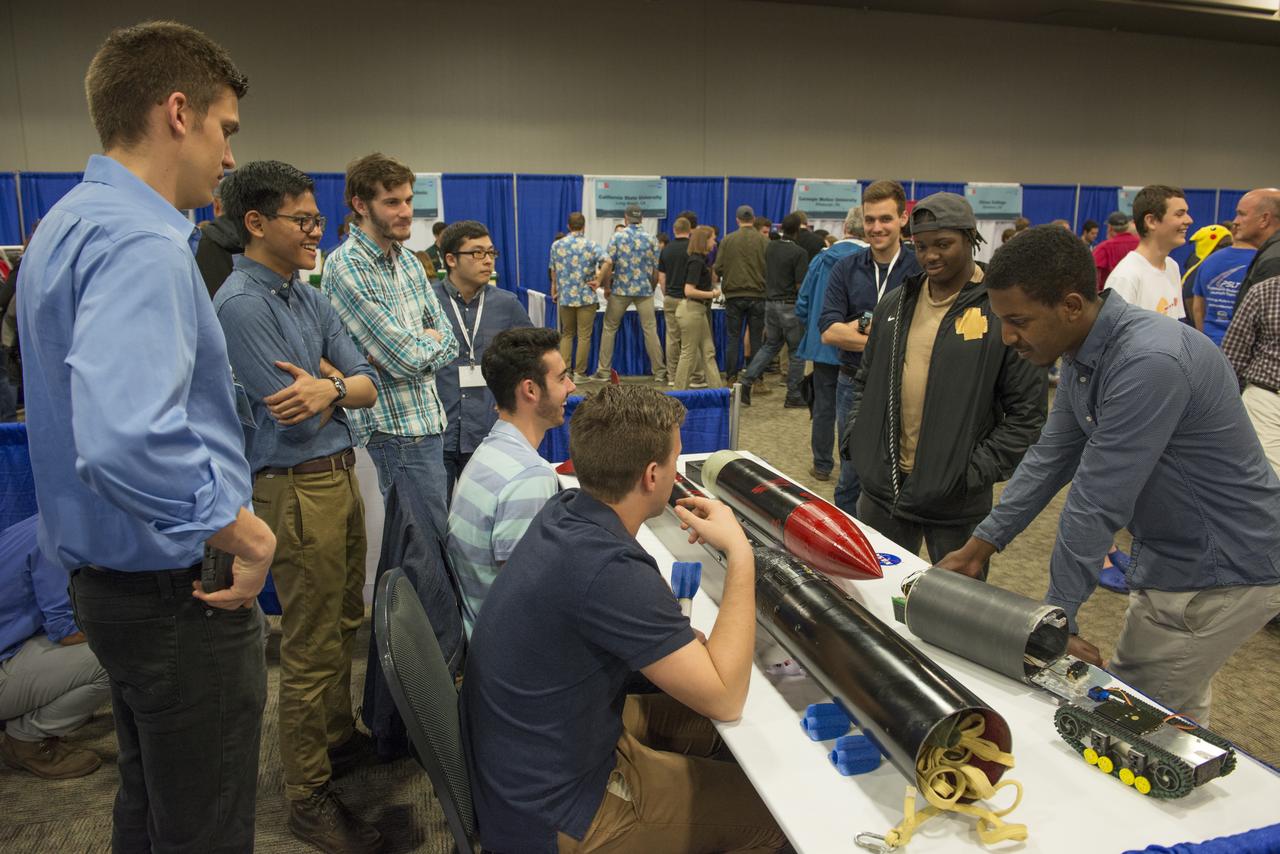 Students from 23 states display their rockets and talk about what they did to make them fly at the NASA Student Launch Rocket Fair on Friday, April 6. Over 800 students traveled to Huntsville, Alabama, to participate in a week of activities as part of NASA Student Launch.
