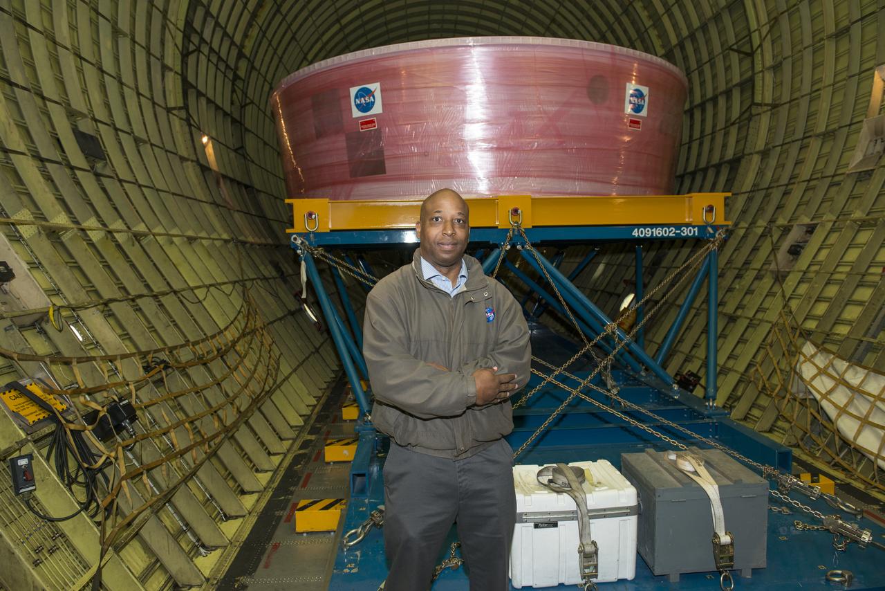  NASA's Super Guppy aircraft arrives to the U.S. Armyâ€™s Redstone Airfield in Huntsville, Alabama, April 2, to pick up flight hardware for NASAâ€™s Space Launch System â€“ its new, deep-space rocket that will enable astronauts to begin their journey to explore destinations far into the solar system. The Guppy will depart on Tuesday, April 3 to deliver the Orion stage adapter to NASAâ€™s Kennedy Space Center in Florida for flight preparations. On Exploration Mission-1, the first integrated flight of the SLS and the Orion spacecraft, the adapter will connect Orion to the rocket and carry 13 CubeSats as secondary payloads.  Rumaasha Maasha stands in front of the Orion stage adapter in the cargo hold of NASA's Super Guppy aircraft. The Orion stage adapter, the top of the rocket that connects the Space Lauch System to Orion, will carry 13 CubeSats as secondary payloads on Exploration Mission-1, the first integrated flight of SLS and the Orion spacecraft. Guppy transported the adapter to Kennedy Space Center April 3.