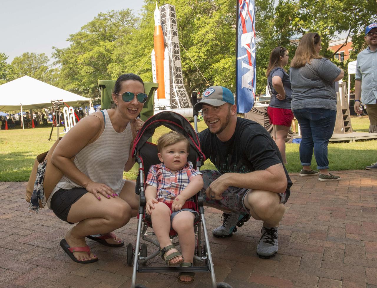 NASA in the Park on June 16 in Huntsville featured more than 60 exhibits and demonstrations by NASA experts, as well as performances by Marshall musicians, educational opportunities, games and hands-on activities for all ages.  NASA employee Renae Scoble and her husband Ryan and son Titus enjoy the the fun and games at NASA in the Park. 
