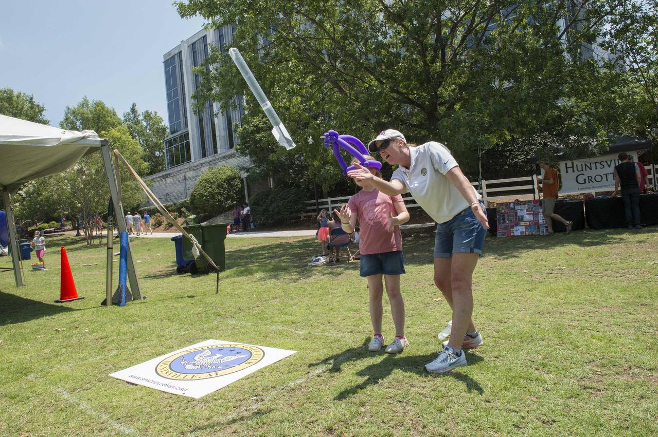 NASA in the Park on June 16 in Huntsville featured more than 60 exhibits and demonstrations by NASA experts, as well as performances by Marshall musicians, educational opportunities, games and hands-on activities for all ages. National Space Club members help demonstrate propulsion principles at NASA in the Park.